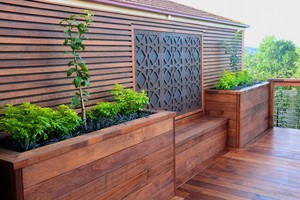 Melbourne Decking Pic 4 - Merbau decking with a custom made screen planters and built in seating by Melbourne Decking