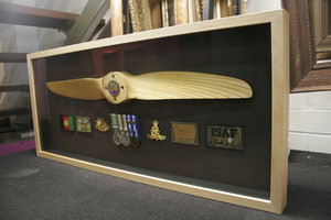 ARTIS PURA Custom Framing Pic 4 - Custom 3D box Picture Framing example by ARTIS PURA Propeller from a drone with medals and patches