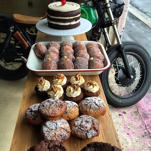 Rising Sun Workshop Pic 2 - Doughnuts stuffed with lemon curd chocolate orange muffins carrot toffee walnut cupcakes bacon and egg scrolly things