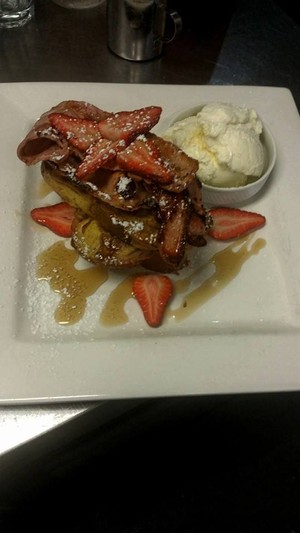 Sned's Lakeview Cafe Pic 4 - Who doesnt love French Toast Egg Cinnamon coated thick cut fried Brioche bread w Bacon Strawberries Maple Syrup Vanilla Icecream its the ultimate breakfast indulgence