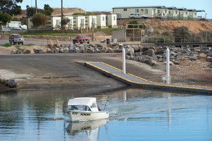 Point Turton Caravan Park Pic 2 - Boaleaving the boat ramp with the caravan park in the background