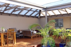 Elite Decks and Pergolas Pic 4 - L shaped pergola with matching decking transformed to an amazing entertaining area