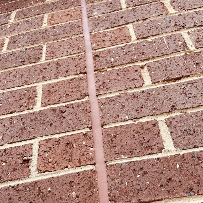 Professional Caulking Group Pic 1 - An example of the clean lines our team complete for this expansion joint