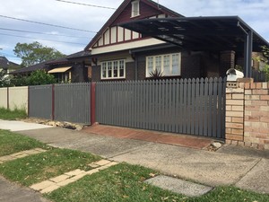 Australian Auto Gates Pic 3 - Automatic Sliding Gate clad with pickets to match existing fencing at Earlwood