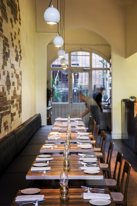 Saint Crispin Pic 1 - Long banquette seating features in our dining room