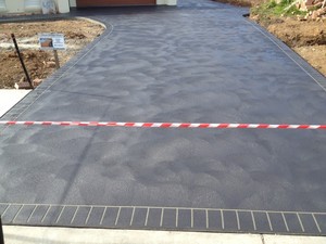 Concrete Driveways Sydney Pic 3 - Hand cove concrete driveway with brick stencil header course