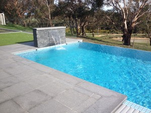 The Landscaped View Pic 5 - Granite paving and stackstone water feature