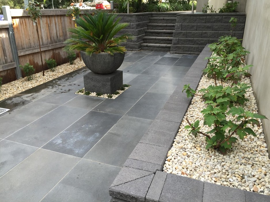 The Landscaped View Pic 1 - Honed Bluestone paving with Charcoal Allan Block wall and steps