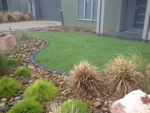 The Landscaped View Pic 4 - Random step stones exposed aggregate concrete with Synthetic Grass