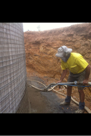 Town & Country Concrete Water Tanks Pic 2 - Outside spraying applied to underground tanks Note the galvanized reinforcement Six coats applied to the wall of each tank Dubbo