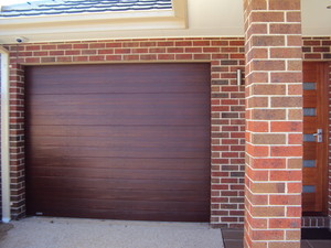 Advanced Automatic Garage Doors Pic 2 - Colorbond Timber look panel lift door