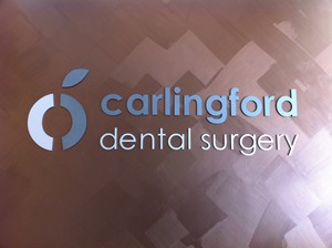 Carlingford Dental Surgery Pic 5 - Metalic logo on Reception Wall