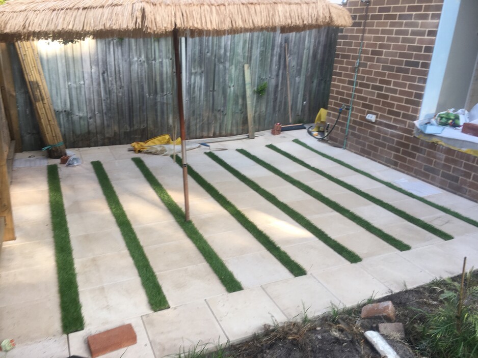 Dee Why Beach Building and Maintenance Pic 1 - paved area using 400mm pavers from anthrock and synthetic grass