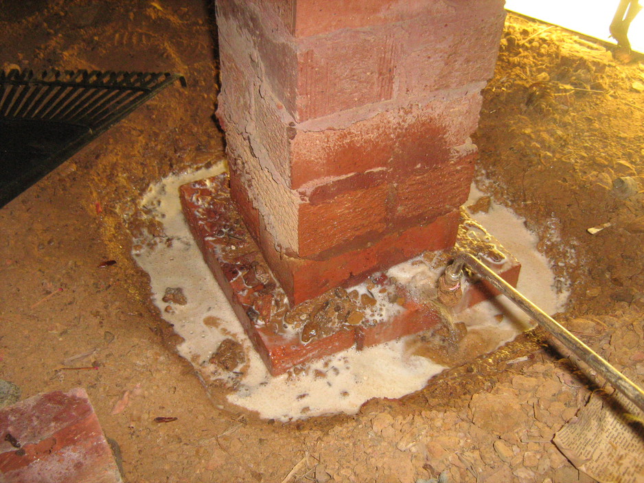 National Pest Solutions Pic 1 - treating soil around a subfloor pier