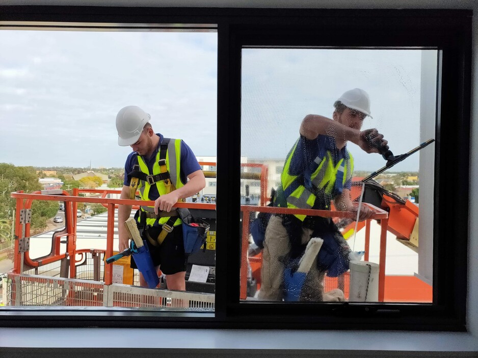 Lighthouse Cleaning Services Pic 1 - The window cleaners at Lighthouse Cleaning doing a great job