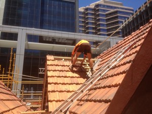 Jim Russell Roofing services Pic 2 - new dormer built for air extraction being retiled with clay tiles to match existing due to the site being heritage listed