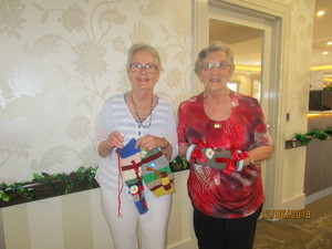 Royal Freemasons Sale Pic 4 - Resident knitters Nola Scott Norma Jackson with their own version of twiddle muffs