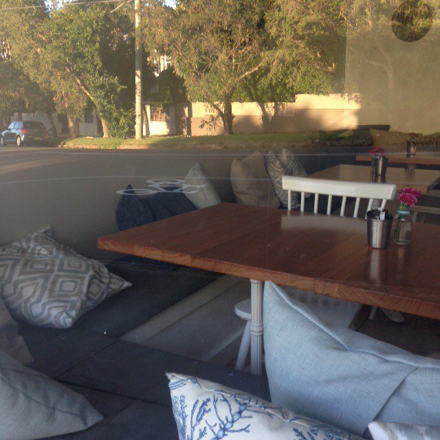 4 Beans Co Pic 1 - Lots of seating with cushions inside and they even have blankets draped on the outdoor seating