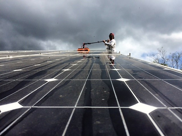 AKM Solar Clean Pic 1 - Are you getting the most out of your solar system Thats Kris putting a shine on those panels