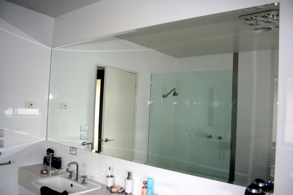 HORSHAM DOORS AND GLASS Pic 1 - Arissed mirror in residential setting with shower glass panel