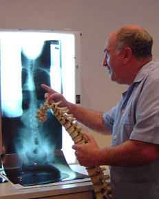 Randwick chiropractic & osteopathic centre Pic 1 - peter yannakis looking at a patients xray