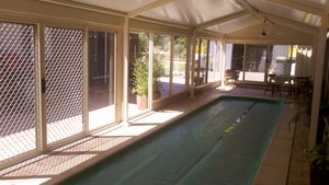 Assured Glass and Aluminium Pic 4 - Commercial frame pool enclosure with sliding doors Complies with all council regulations