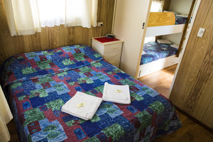 Galaxy Caravan Park Pic 2 - The queen sized bed in one of our tourist cabins