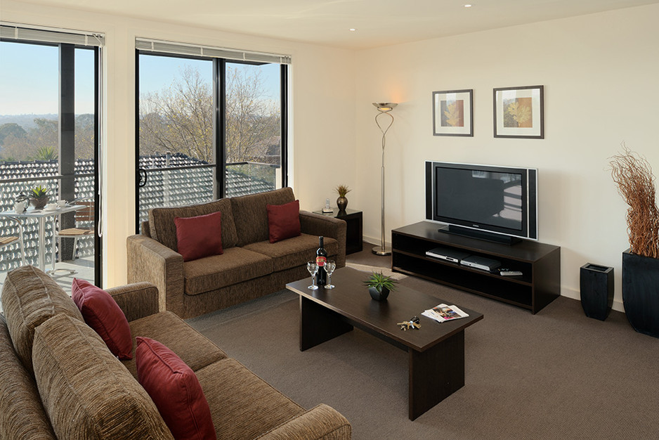 Apartments @ Q105 Pic 1 - Spacious open plan living with large TV DVD player Foxtel