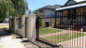 Residential Gates Pic 5 - Automatic Sliding gate in Tubular Steel Matching Pedestrian gate and Infill Panels