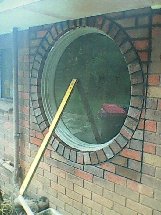 Joel Malcolm Pic 1 - Removed existing window and put in round window over spa for client