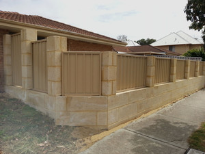 Mark C's Carpentry and Building Works Pic 4 - Limestone retaining wall with colourbond fencing