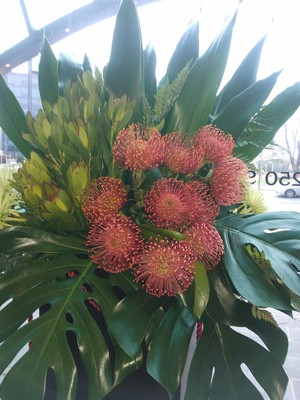 The Floral Art Studio Pic 4 - Stunning large foyer arrangement in red and yellow