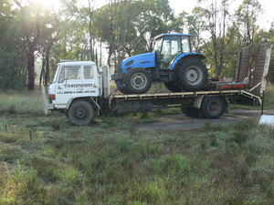 J & L Davies & Sons Pic 4 - One of our trucks delivering our 90hp 4wd tractor to a customers farm for slashing work