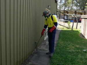 J & L Davies & Sons Pic 3 - Spraying around shed for spiders and other crawling pest