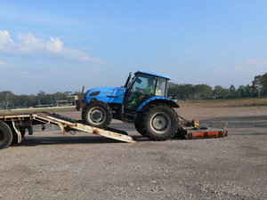 J & L Davies & Sons Pic 5 - Unloading tractor at commercial slashing site