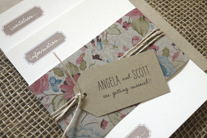 Papermarc Pic 3 - A whimsical wedding invitation featuring floral belly band tied with a natural twine and a recycled brown tag