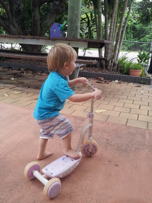 Little Learners Family Day Care Pic 2 - Master RP is learning to ride the scooter Riding bikes scooters helps to develop fine gross motor skills as well as sensory perception skills