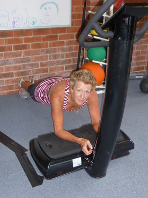 Peak Performance Personal Trainers Pic 2 - Planking on the vibrating machine