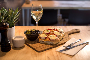 MO Surry Hills Pic 3 - Caprice garlic bread olives and a glass of Suave