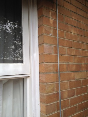 Fred R. Heimann Co. Pty. Ltd. Pic 4 - Brickwork back to window frame after lift