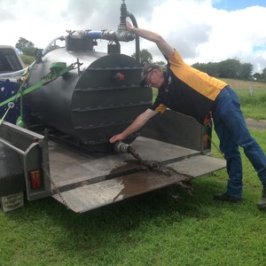 Deem Contracting Pic 3 - Emptying sludge after cleaning rainwater tank