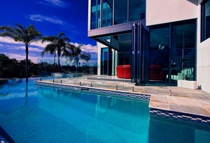 Bali Pools Pic 5 - Completed by Bali Pools this is a large modern style pool wrapped around the house view with a lovely view