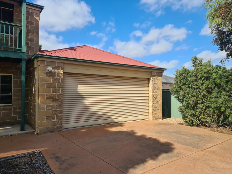 Garage And Roller Door Services Pic 1 - A new garage door replacement we did the update totally changed the look of the house This was the before