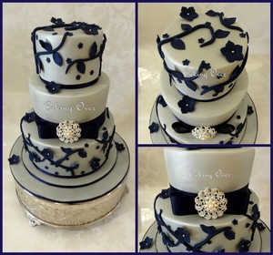 Caking Over Pic 4 - Navy blue and silver wedding cake with brooch Top tier marble whitechocolate mud Middle tier red velvet with cream cheese fudge icing Bottom tier chocolate mud with ganache