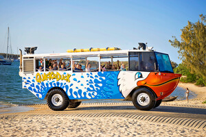 Quack'r Duck Pic 3 - QuackrDuck amphibious vehicle parked on sand with happy tourists on board