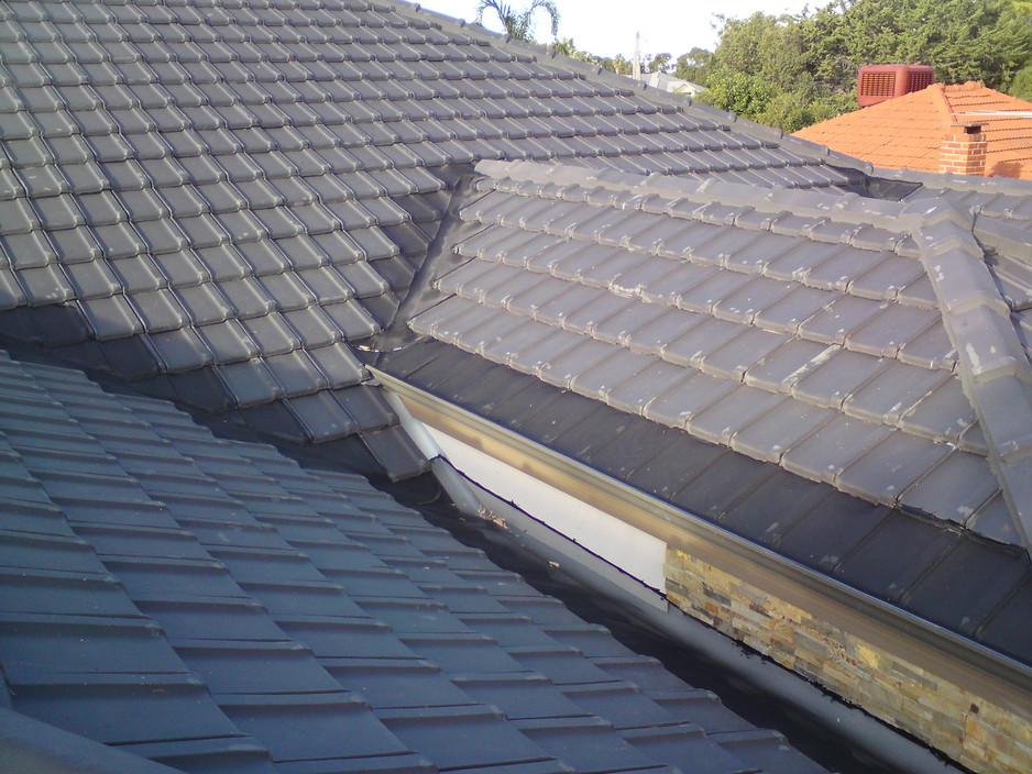 WA External Solutions Pic 2 - guttermesh gutter guard on valleys and guttering on a tile roof