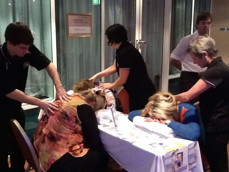 Australasian Academy of Wellness Therapies Pic 1 - Students working at IAAMA conference in Sep 2013