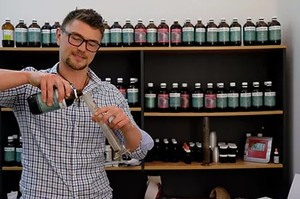 Cameron Barker, Naturopath Pic 5 - Cameron mixing a personalised tincture to help treat a patients specific health condition