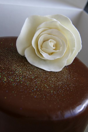 Bliss Chocolate Cakes Pic 3 - Elegance Kahlua chocolate fudge cake with hazelnut praline whipped chocolate ganache Chocolate glaze finish with hand made rose