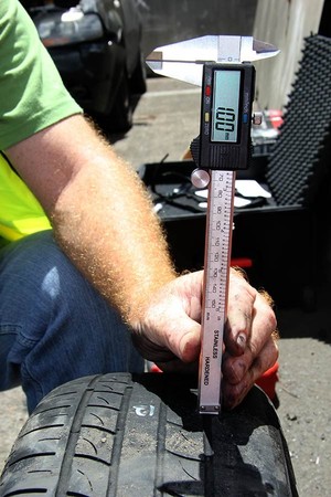 Accident Causation Investigation Services Pty Ltd Pic 2 - Measuring tyre tread depth using Vernier caliper on a particular tyre as part of a motor vehicle crash investigation